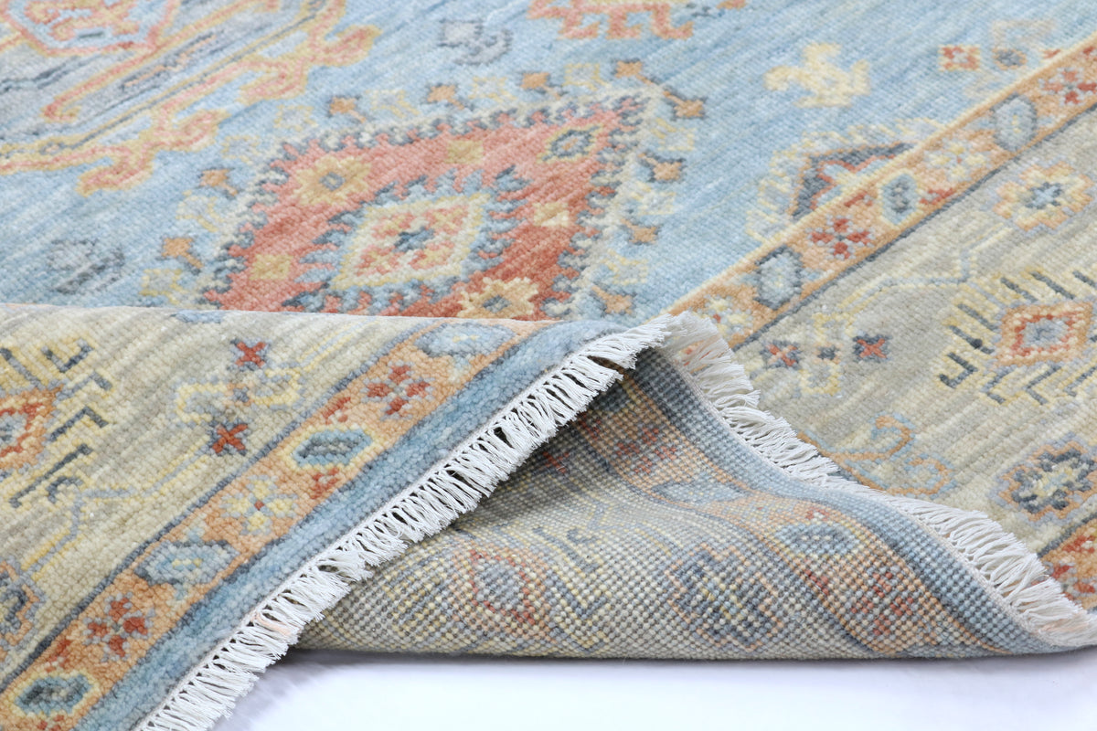 Close-up of a patterned rug with a white background