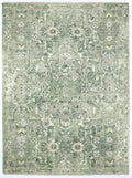 Green and beige patterned rug on a plain background