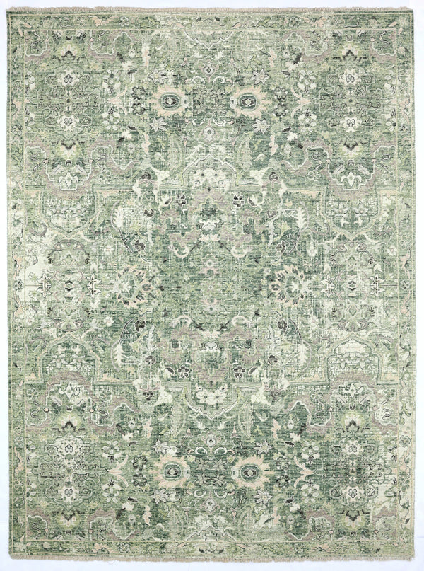 Green and beige patterned rug on a plain background