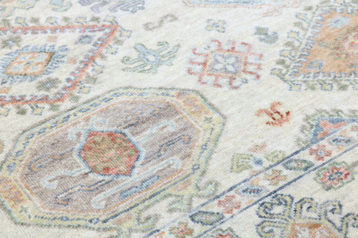 Close-up of a patterned rug with multicolor design on a light background