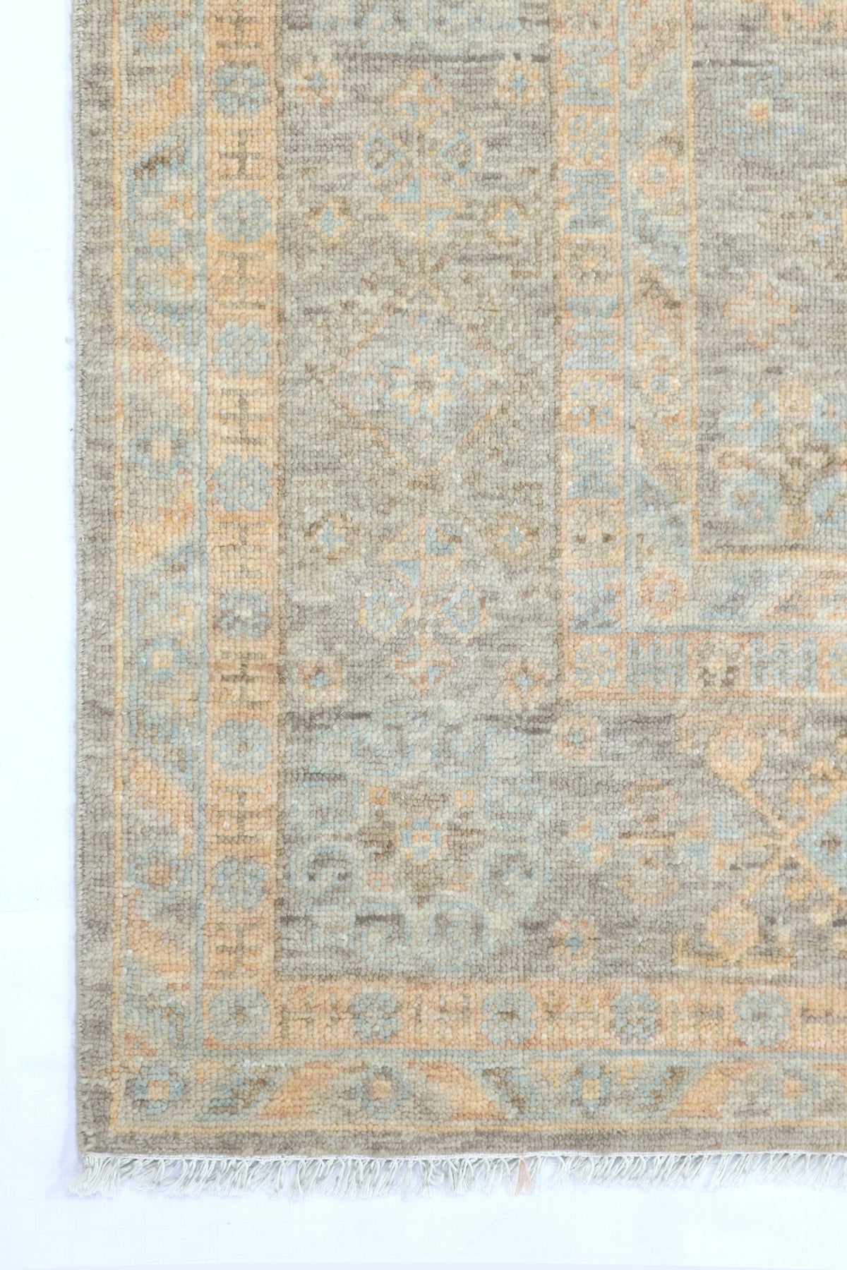 Patterned rug with a geometric design on a white background