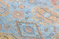Close-up of a patterned rug with blue and orange colors
